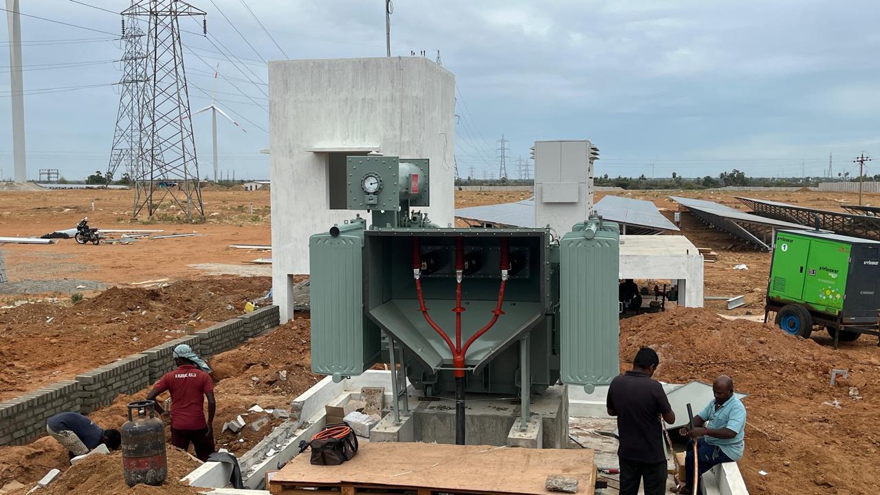 Technicians working on a solar panel array
